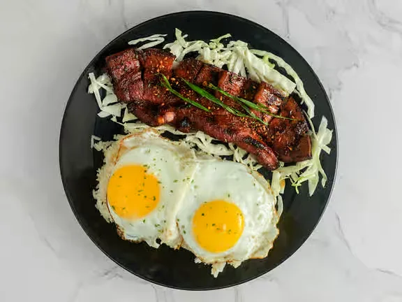 Grilled Liempo pork belly at Kalesa Korner Filipino restaurant in Winnipeg, MB